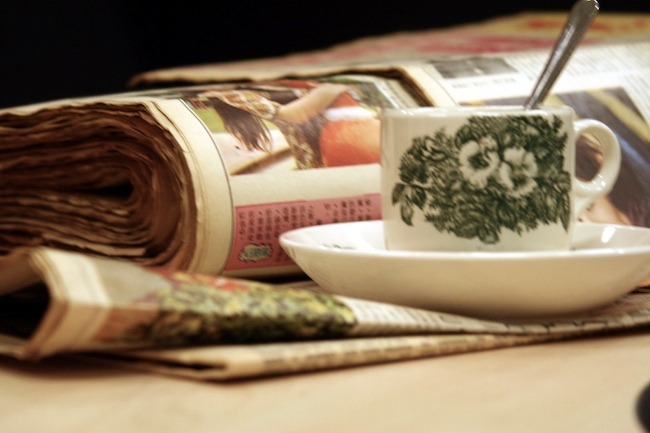 Newspapers and coffee close-up